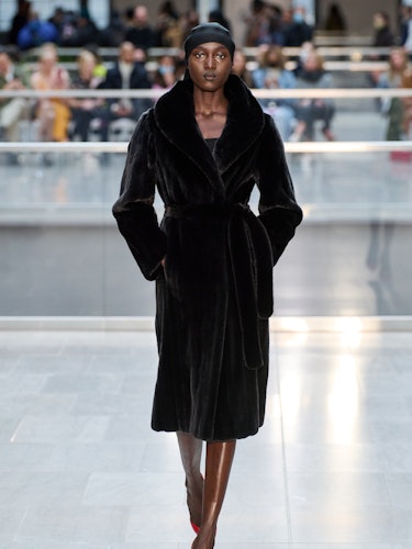 A model in a Victor Glemaud black fur coat